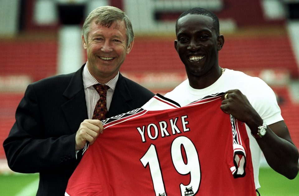  Sir Alex Ferguson poses with Dwight Yorke after this £12.9m move from Aston Villa