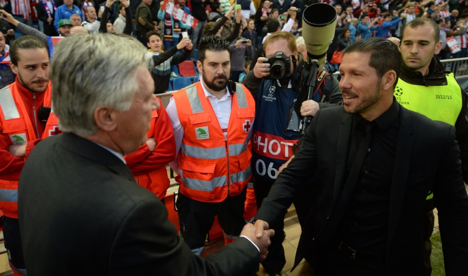 MADRID, SPAIN - APRIL 14: Head coach Diego Simeone (R) of Atletico Madrid shakes hand with head coach Carlo Ancelotti of Real Madrid during the UEFA Champions League Quarter Final First Leg match between Club Atletico de Madrid and Real Madrid CF at Vicente Calderon Stadium on April 14, 2015 in Madrid, Spain. (Photo by Evrim Aydin/Anadolu Agency/Getty Images)