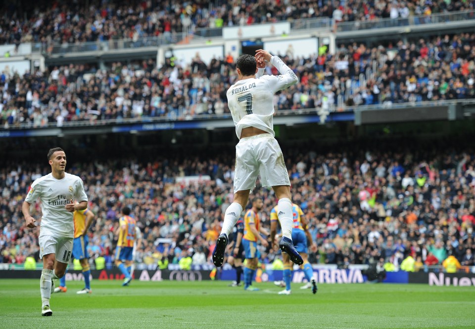 MADRID, SPAIN - MAY 08: Cristiano Ronaldo of Real Madrid celebrates his team's opening goal with Lucas Vazquez during the La Liga match between Real Madrid CF and Valencia CF at Estadio Santiago Bernabeu on May 8, 2016 in Madrid, Spain. (Photo by Denis Doyle/Getty Images)