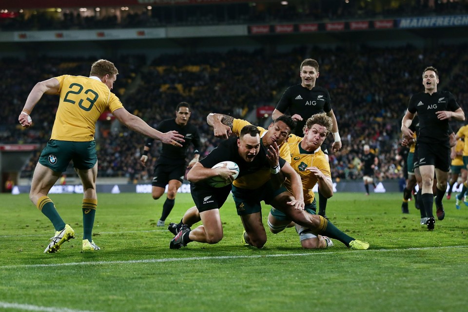 WELLINGTON, NEW ZEALAND - AUGUST 27: Israel Dagg of New Zealand scores a try against Israel Folau and Michael Hooper of Australia during the Bledisloe Cup Rugby Championship match between the New Zealand All Blacks and the Australia Wallabies at Westpac Stadium on August 27, 2016 in Wellington, New Zealand. (Photo by Anthony Au-Yeung/Getty Images)