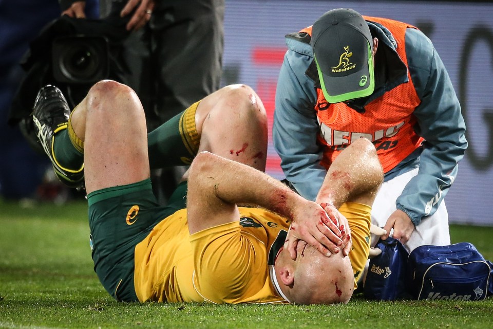 Australia captain Steven Moore is tended to by the medical staff