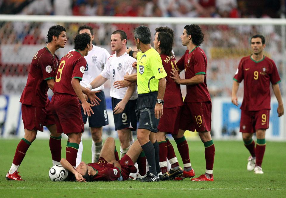 Gelsenkirchen, GERMANY: English forward Wayne Rooney (9) argues with Portuguese midfielder Petit (2nd L) and Portuguese forward Cristiano Ronaldo (L) after being given a red card by Argentinian referee Horacio Elizendo (yellow jersey) for a foul committed on Portuguese defender Ricardo Carvalho on the ground) 01 July 2006 during the World Cup 2006 quarter-final football game England vs. Portugal at Gelsenkirchen stadium. AFP PHOTO / DDP / VOLKER HARTMANN (Photo credit should read VOLKER HARTMANN/AFP/Getty Images)