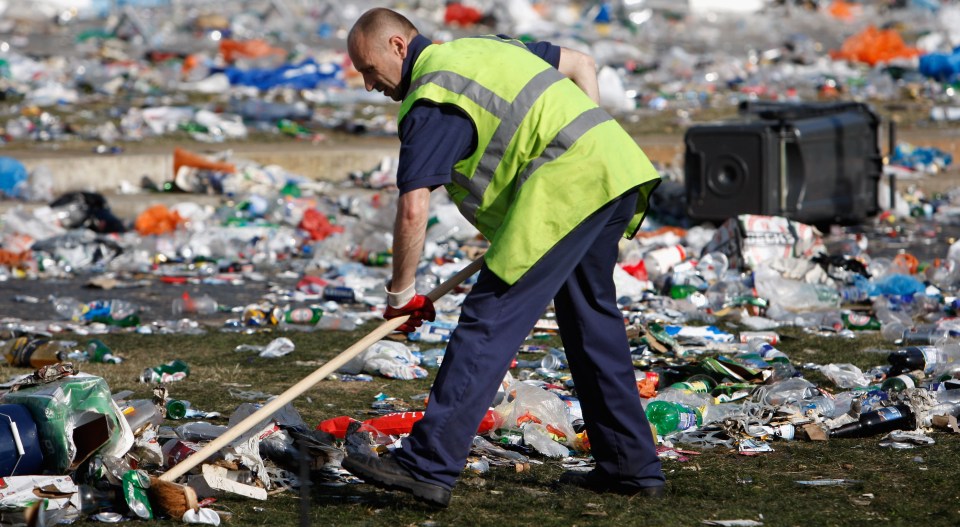 MANCHESTER, UNITED KINGDOM - MAY 15: Street cleaners tidy up the debris in Piccadilly Gardens after last nights UEFA Cup Final between Rangers and Zenit St Petersburg on May 15, 2008 in Manchester, England. An estimated 100,000 Rangers fans descended on the city to see the match, which Zenit St Petersburg won 2-0. (Photo by Jeff J Mitchell/Getty Images)