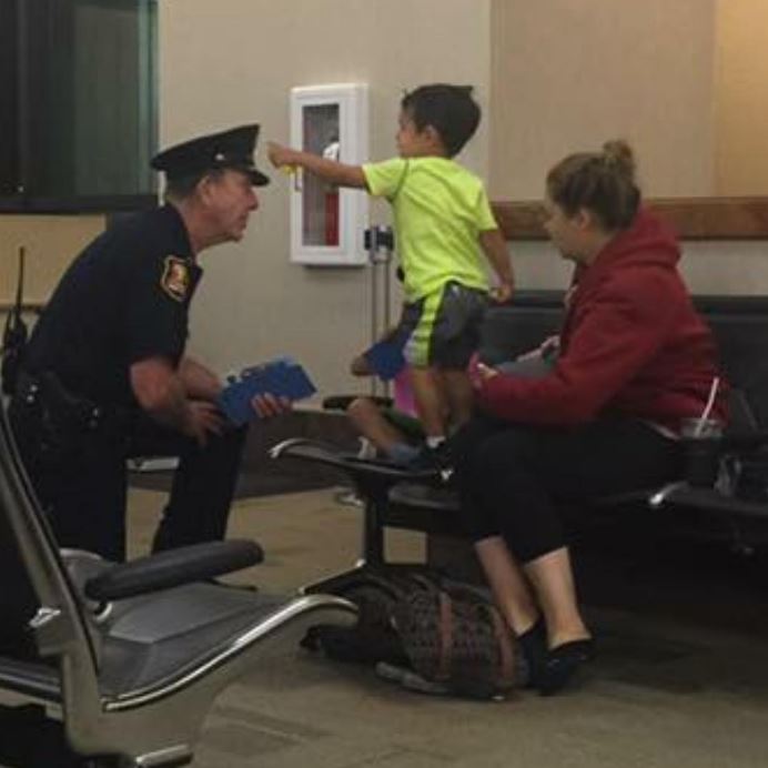  Police came to the airport to hand out crayons and colouring books to those left stranded by the emergency landing