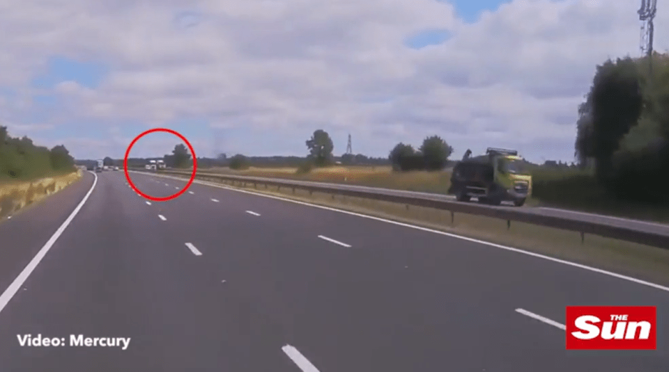  The lorry can be seen in the distance moments before the potentially-fatal collision