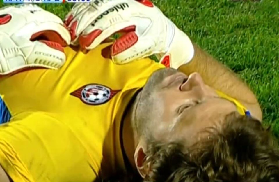 The beaten goalkeeper lies on the ground as he takes it all in