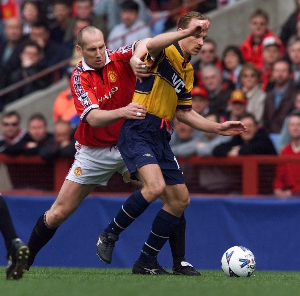 Stam and Dennis Bergkamp were Dutch team-mates but faced each other here in an FA Cup semi