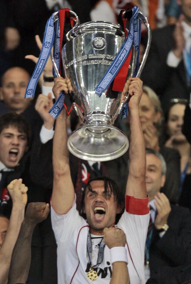 AC Milan's captain Paolo Maldini raises the trophy aloft after his team beat Liverpool 2-1 in 2007