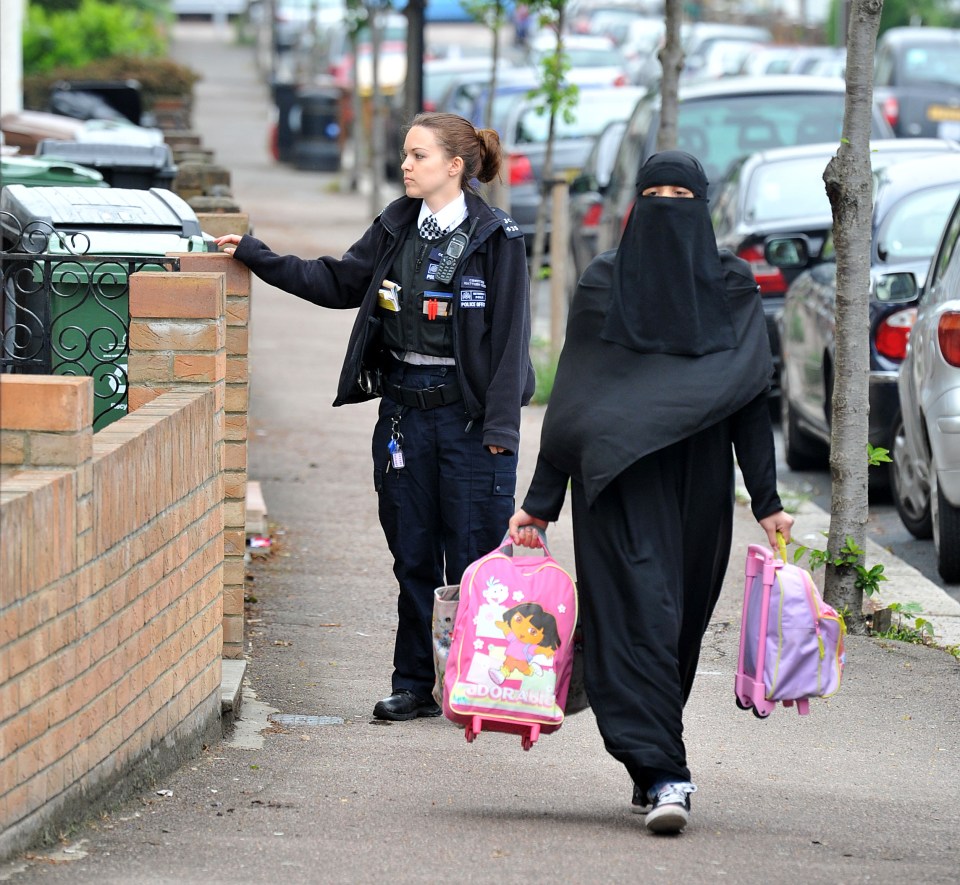  Choudary's family leave their home with police assistance, amid fears they could be targeted by right-wing groups