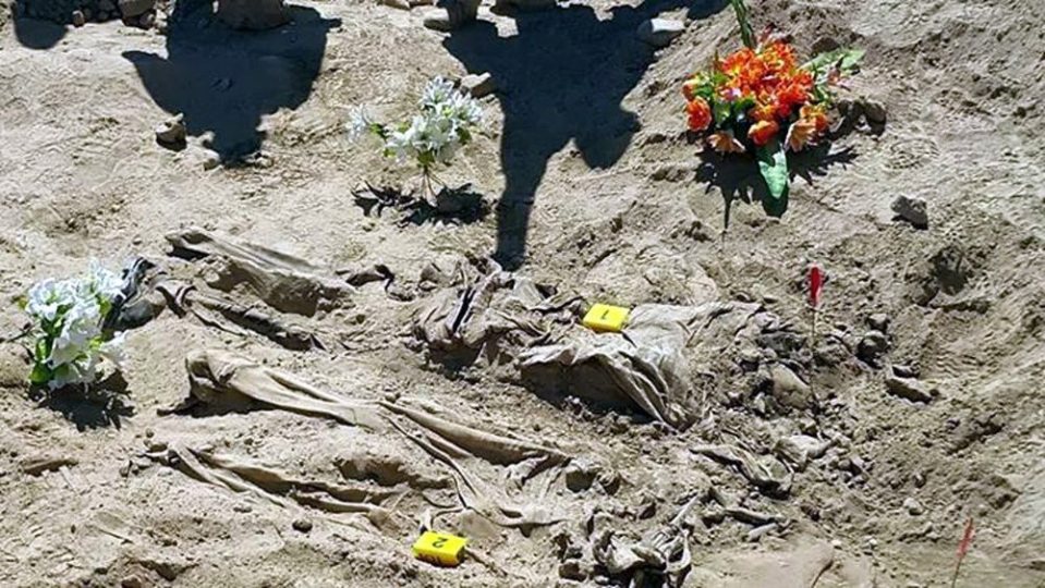  Human remains were found in the desert graves with executions of those involved set down by Iraq officials