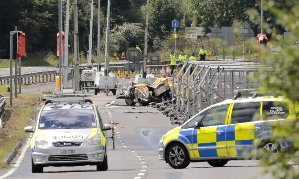  Crash site . . . police investigate horror scenes after crash on A27