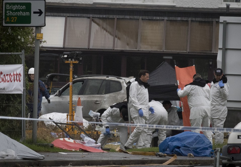  Investigators at the scene of the crash