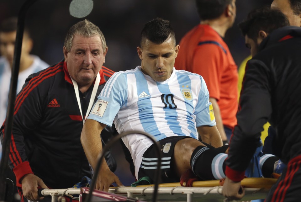 Aguero is carried off in a World Cup 2018 qualifier against Ecuador last year