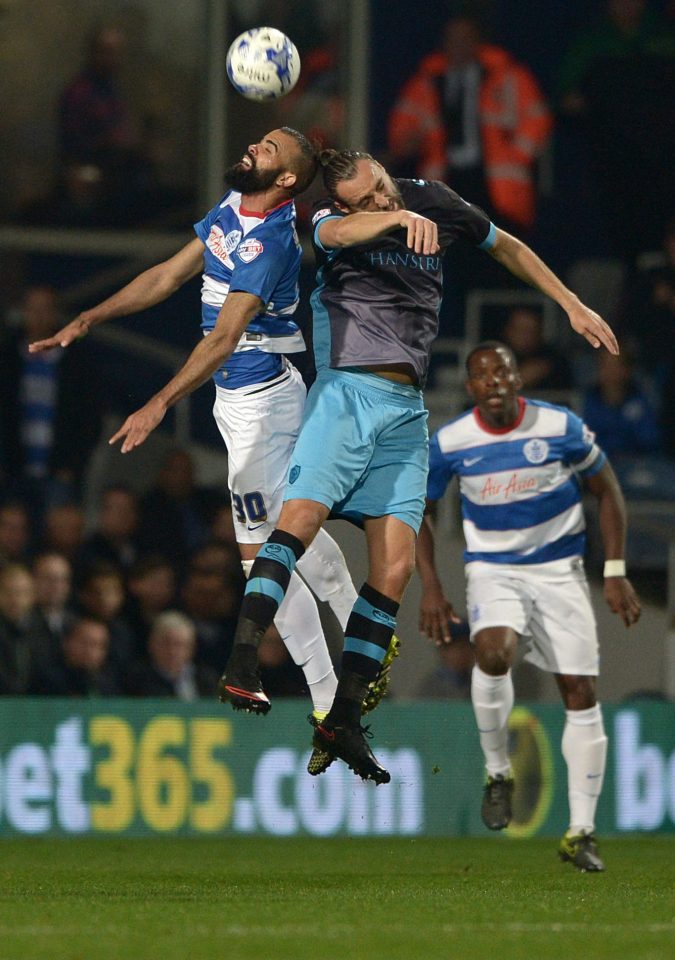  Sandro battles with Sheffield Wednesday star Atdhe Nuhiu in the Championship