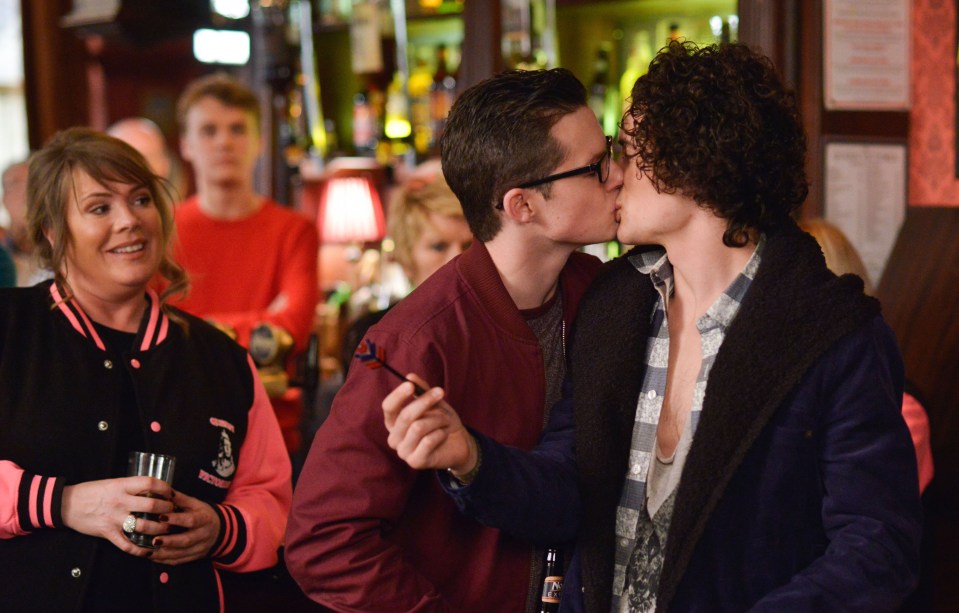 Ben Mitchell and his late lover Paul Coker share a kiss in the Queen Vic