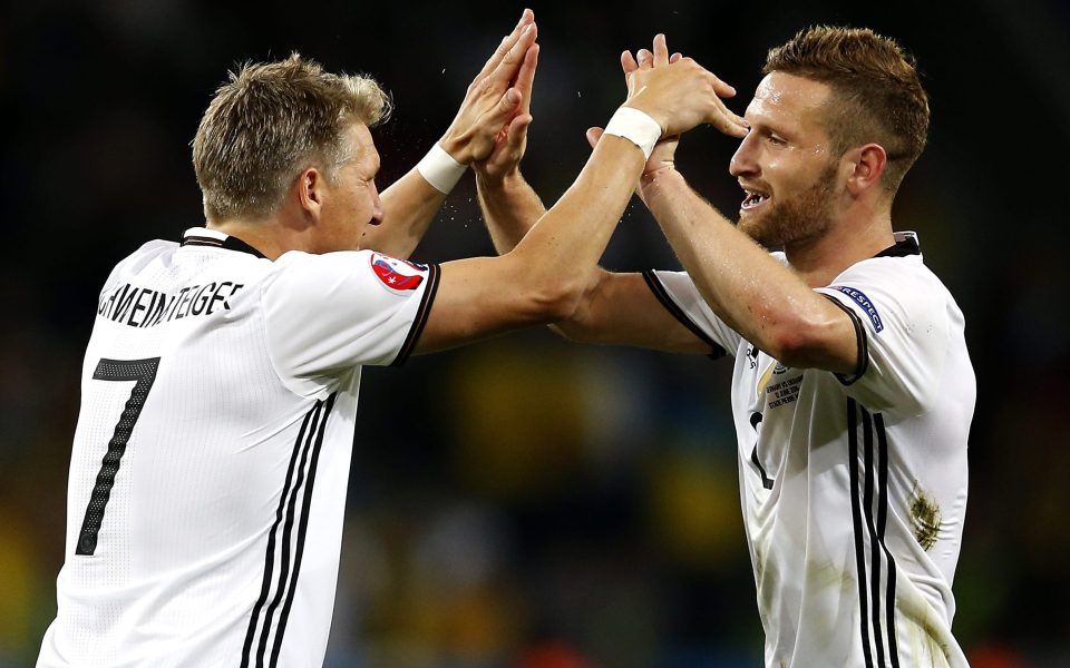  Bastian Schweinsteiger celebrates a Germany goal with much-wanted Mustafi