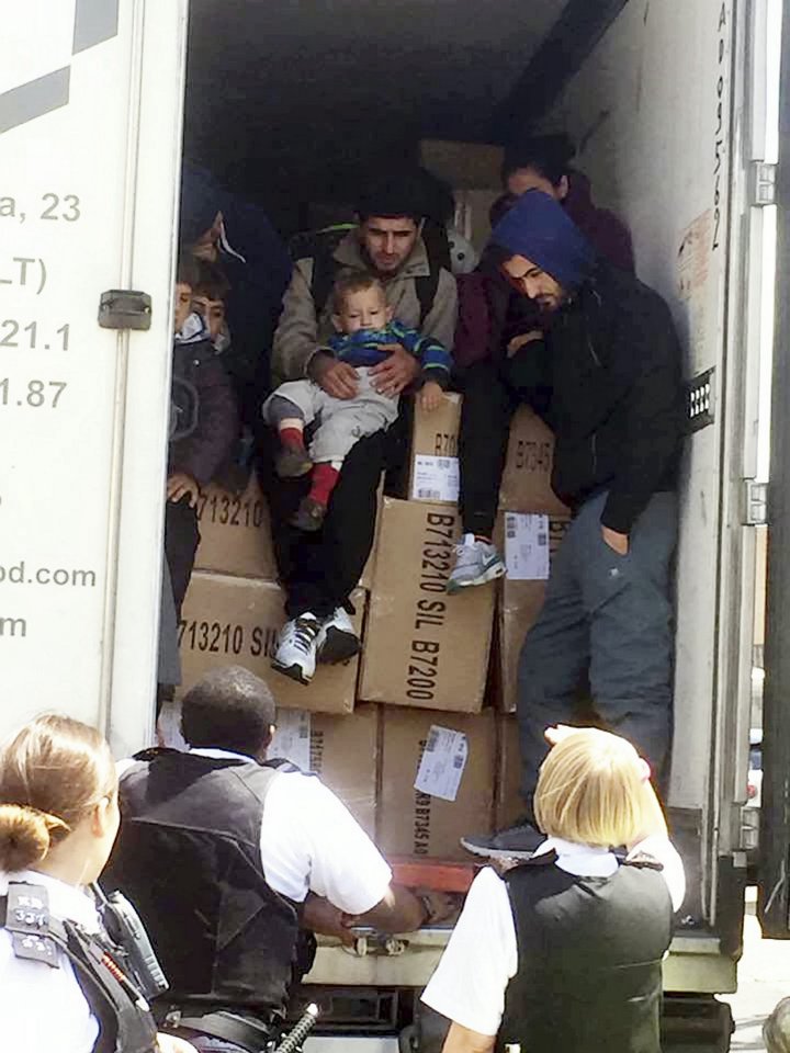  A lorry full of migrants being pulled over by police in London