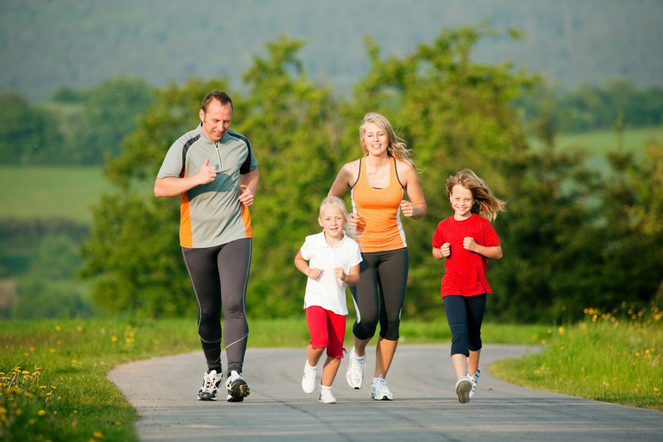 Family jogging outdoors with the kids