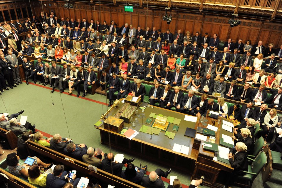 Britain's Prime Minister, Theresa May, addresses the House of Commons during her first Prime Minister's Questions in London