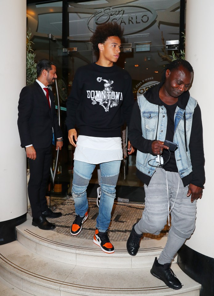  Sane was snapped leaving the San Carlo restaurant with Sergio Aguero