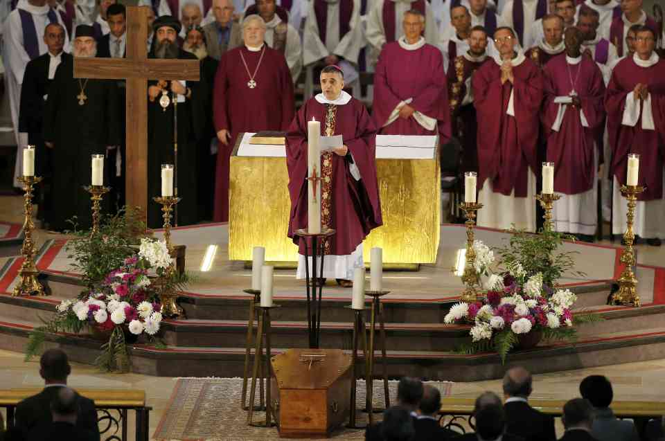 Dominique Lebrun, the Archbishop of Rouen, told the mourners Father Hamel had tried to push off his attackers