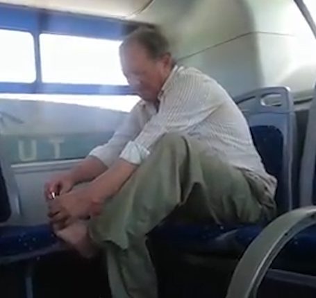  He even used another seat as a footrest to give himself the pedicure