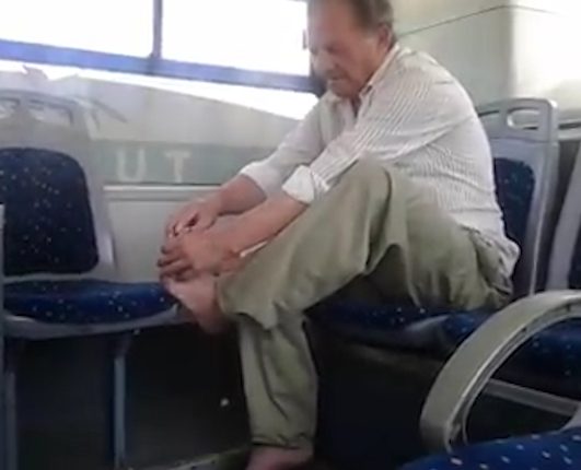  The man clips his toenails on a public bus on Macedonia