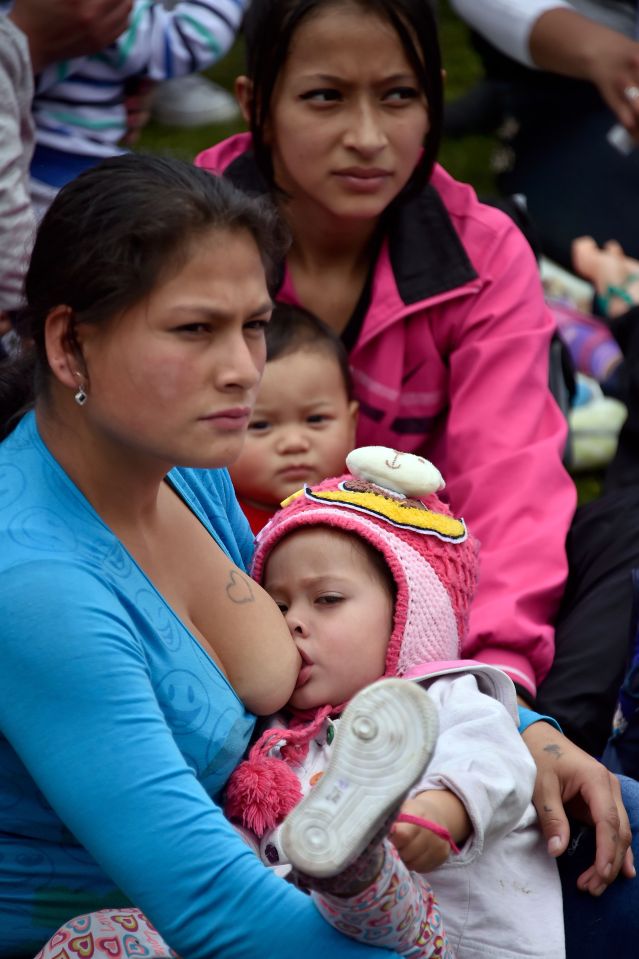  Bogota babies are fed by their mothers in the main park