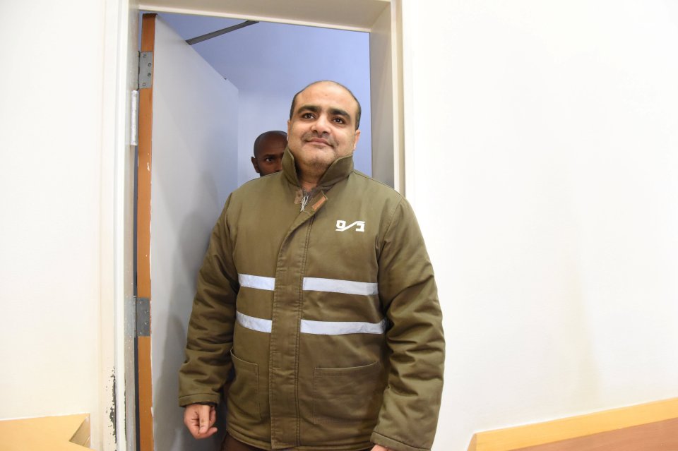 Palestinian Mohammad El Halabi (C), a manager of operations in the Gaza Strip for U.S.-based Christian charity World Vision, is seen before a hearing at the Beersheba district court in southern Israel