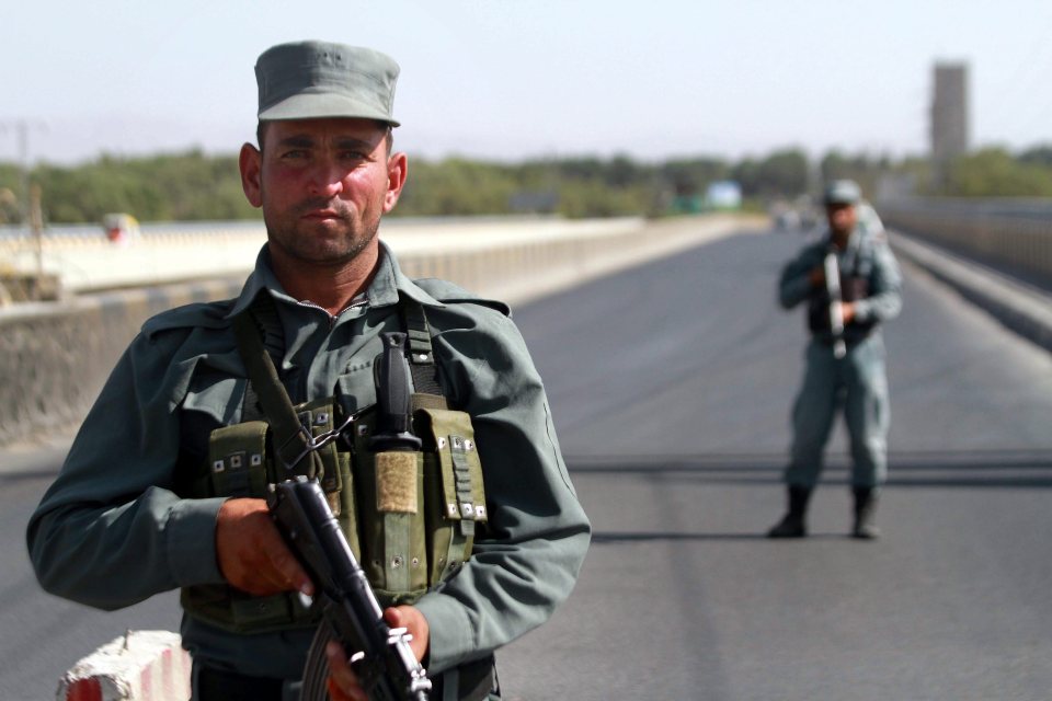  Police guard the highway where the ambush took place