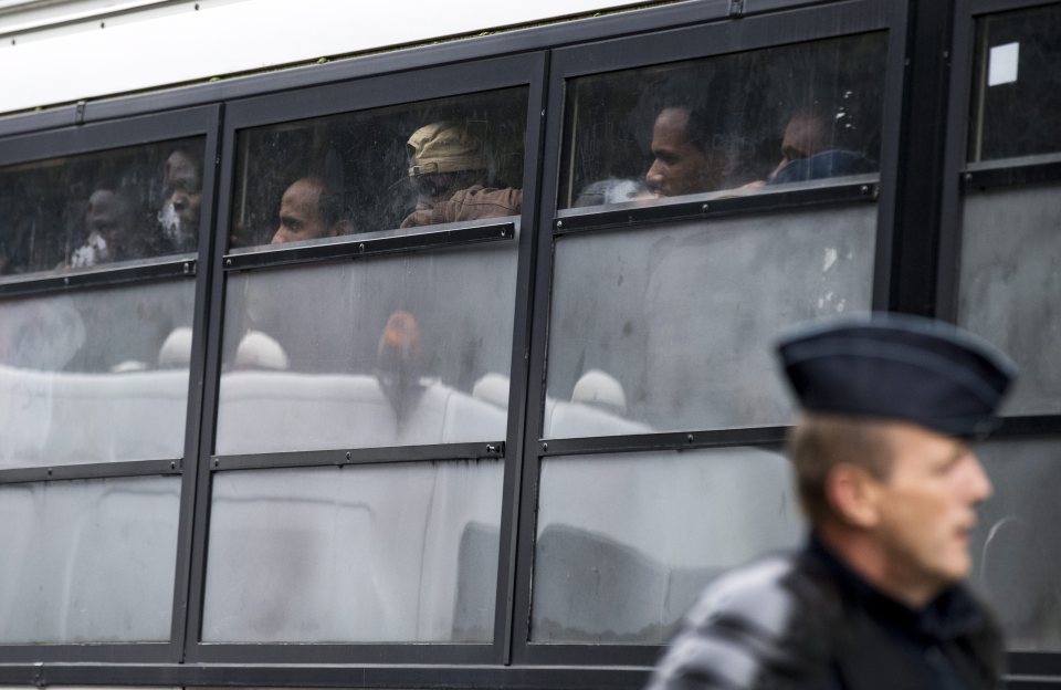  Other migrants watched on as the camp was torn apart by French authorities