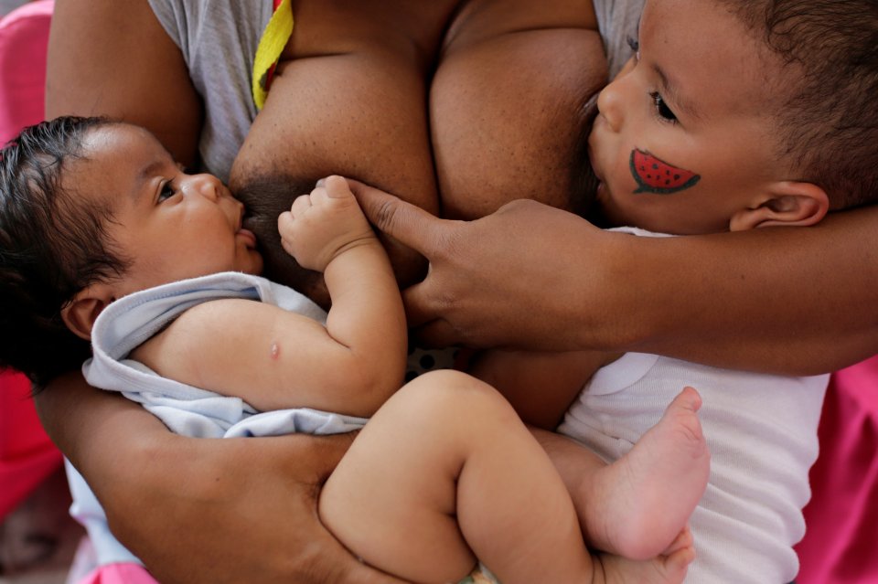  Two for one ... One woman breastfeeds both her babies in Venezuela