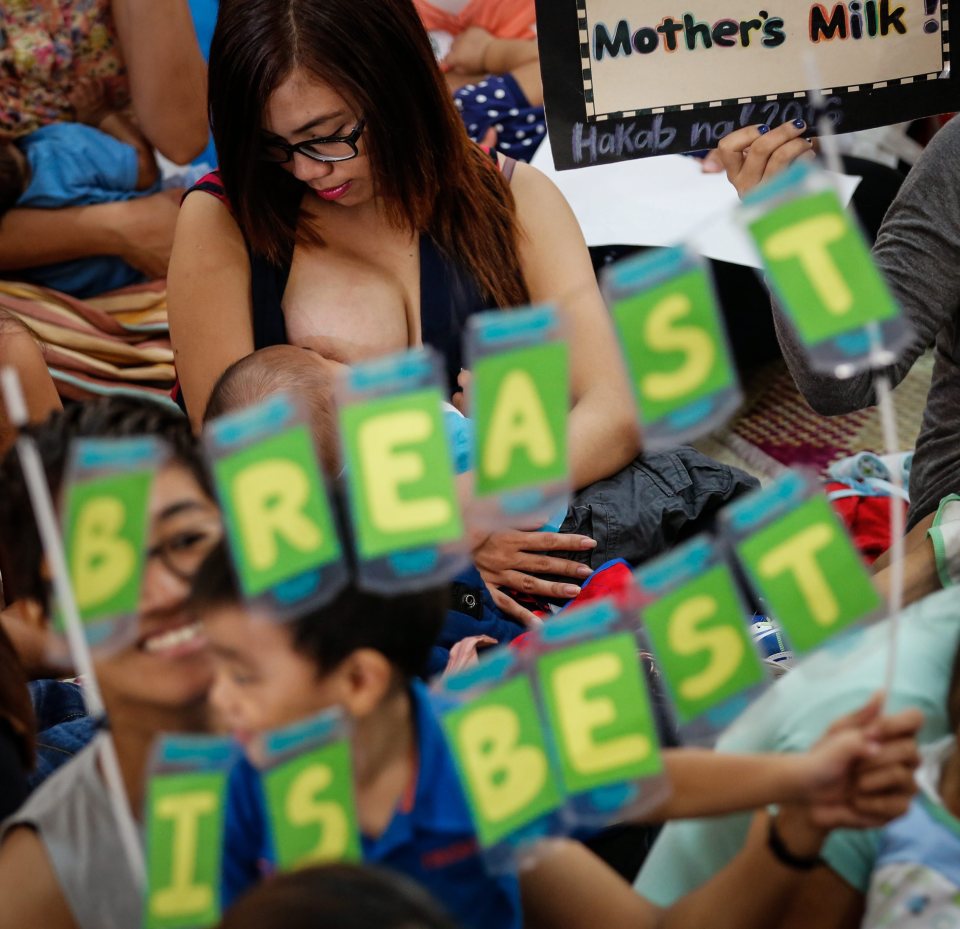  The flash mob with a sign proclaiming 'Breast is Best'