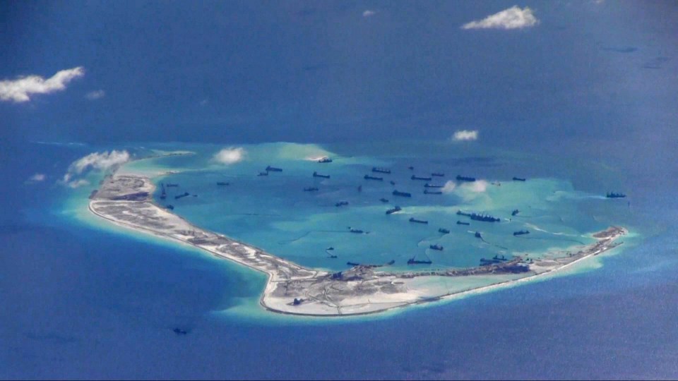  China have been seen conducting military exercises over disputed islands in the South China Sea