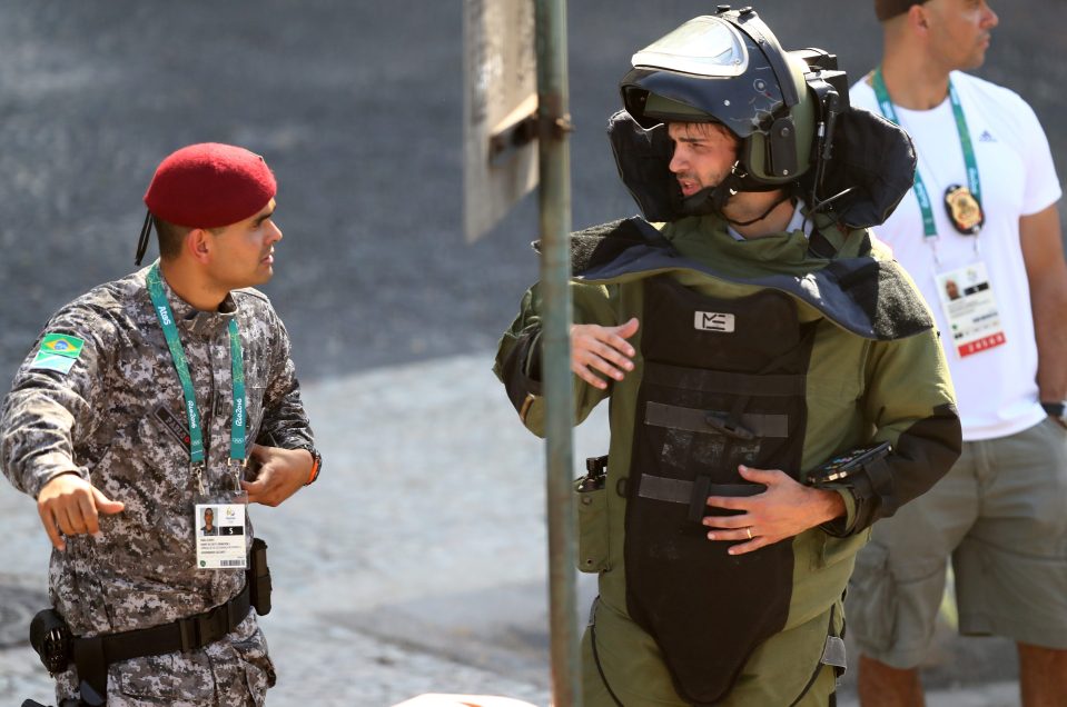  A bomb disposal expert arrives a the scene where a bag was blown up