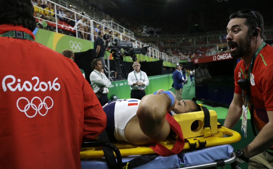  The gymnast was stretchered off by medical officials after the break