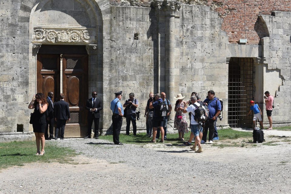 Well-wishers wait outside of the venue