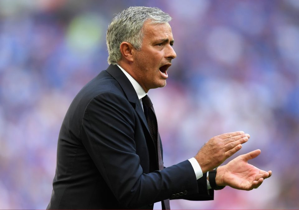 Jose Mourinho makes a gesture on the Wembley pitch