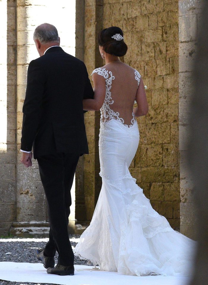 Minttu dazzled in an ivory gown as she made her way into the ceremony with her dad