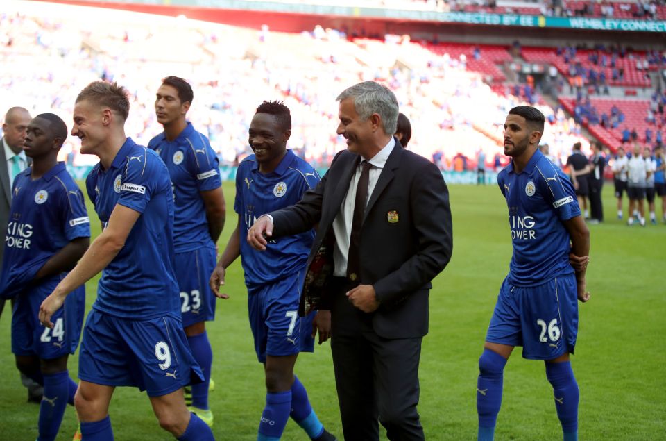  Jose Mourinho shares a joke with the Leicester players after the final whistle