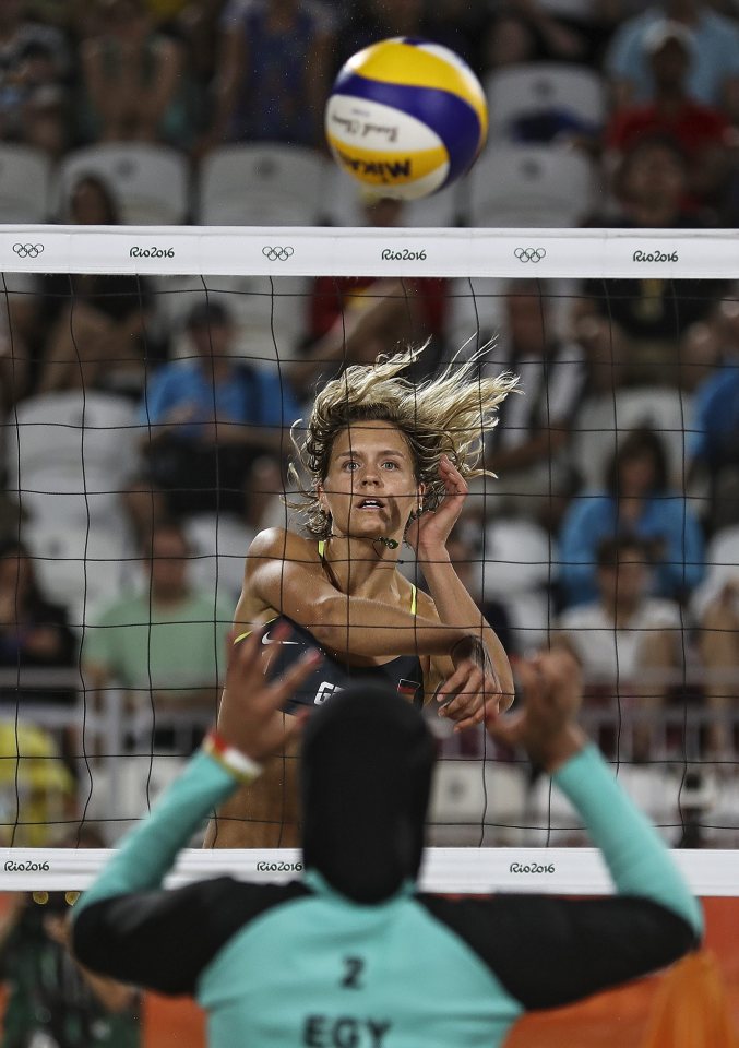  German player Laura Ludwig spikes a ball against the Egyptians