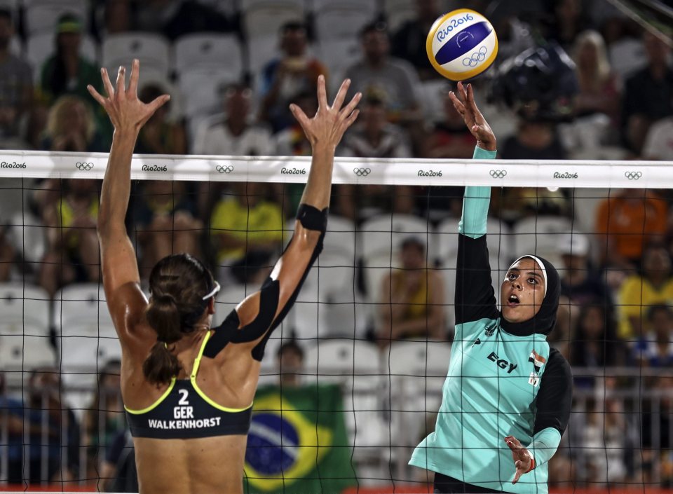  Elgobashy spikes the ball against Kira Walkenhorst of Germany (L) during the women's Beach Volleyball preliminary pool D game against Germany