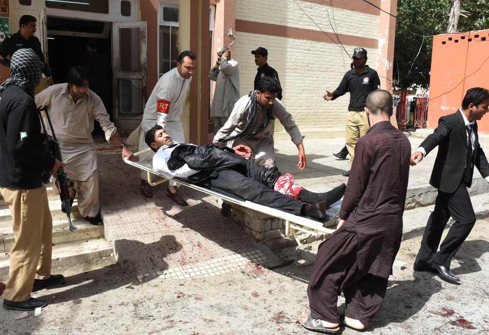  At least 10 people were killed with another 30 injured in the Bilal Anwar Kasi bombing. Volunteers rushed to the scene to help move an injured lawyer after the bombing