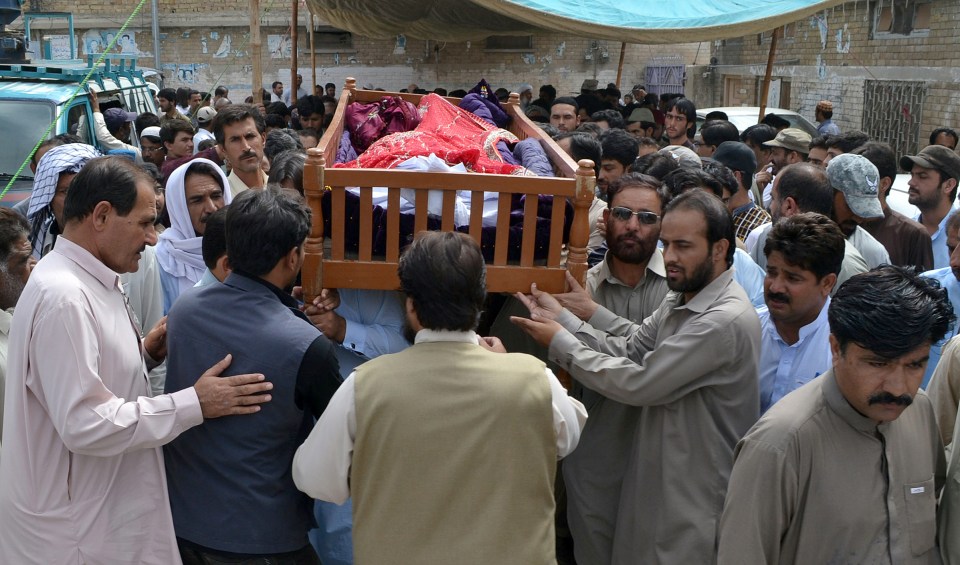  The victim of the suicide bombing is taken away in a coffin