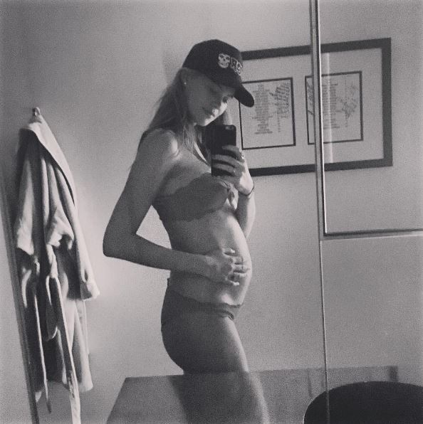  She has kept her social media fans abreast of her blossoming bump and posted another shot wearing a bikini at 15 weeks. Taken in the same bathroom she captioned the photo: "So far so good"