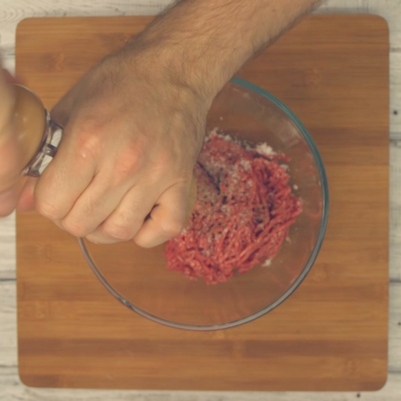  Place mince into a bowl and season with salt and pepper