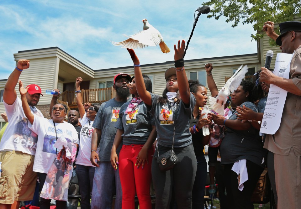 A memorial service earlier in the day had seen mourners release white doves to remember Michael Brown