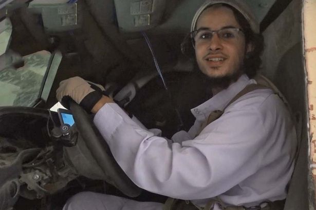 The Belgian smiled as he sat at the wheel of the vehicle. In the background a SatNav appears to be guiding the sick fanatic