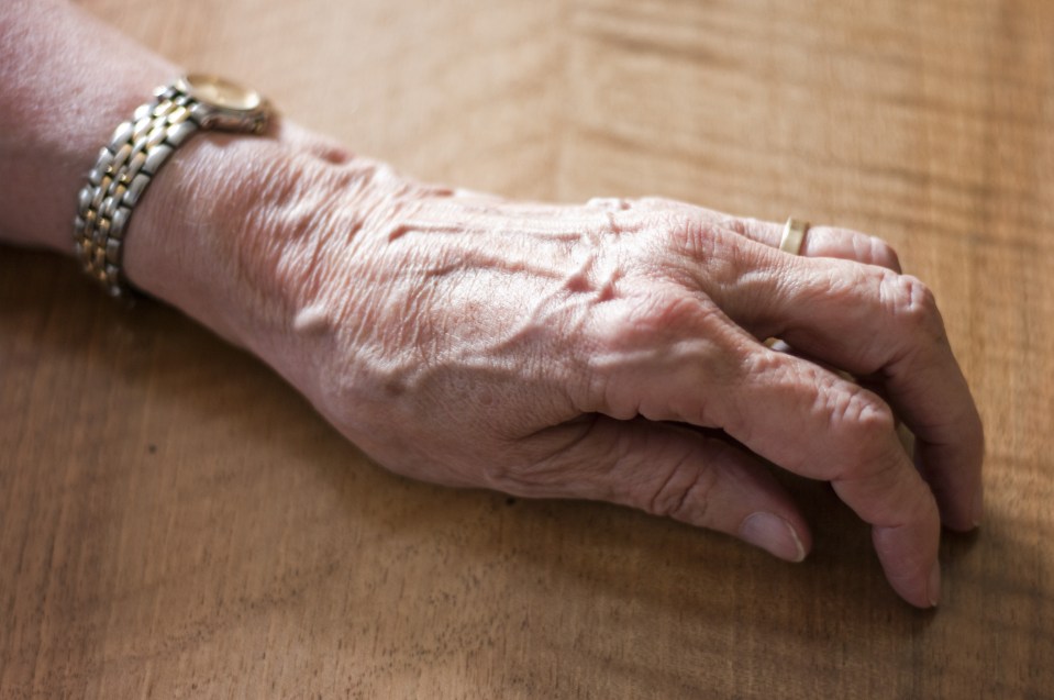 Germany, Hesse, Frankfurt, Human hand on table