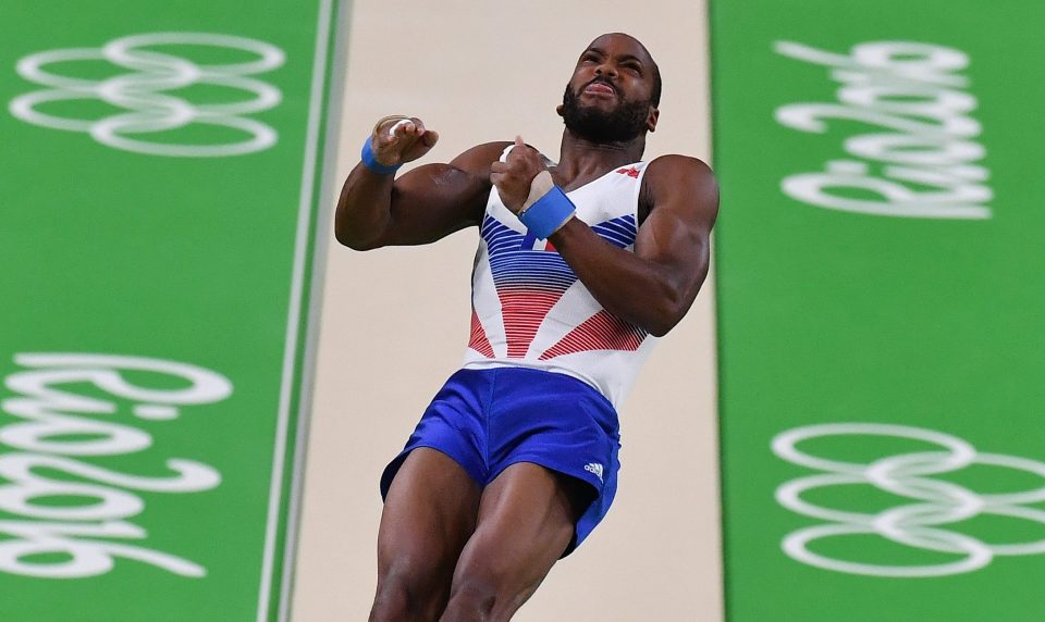  French gymnast Axel Augis shows his vaulting form during a tight gym competition